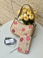 ⁦حقيبة كوتش مع محفظة 💋🤎 قاعدة 22سم⁩ - الصورة ⁦2⁩