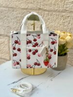 ⁦حقيبة توت باج من كوتش 🍒🤍 قاعدة 25سم⁩ - الصورة ⁦2⁩