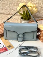 ⁦حقيبة كوتش تابي، اصدار 3d ، ازرق لامع، قاعدة 27سم⁩ - الصورة ⁦3⁩